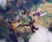 Skydivers Over The Colored Landscapes