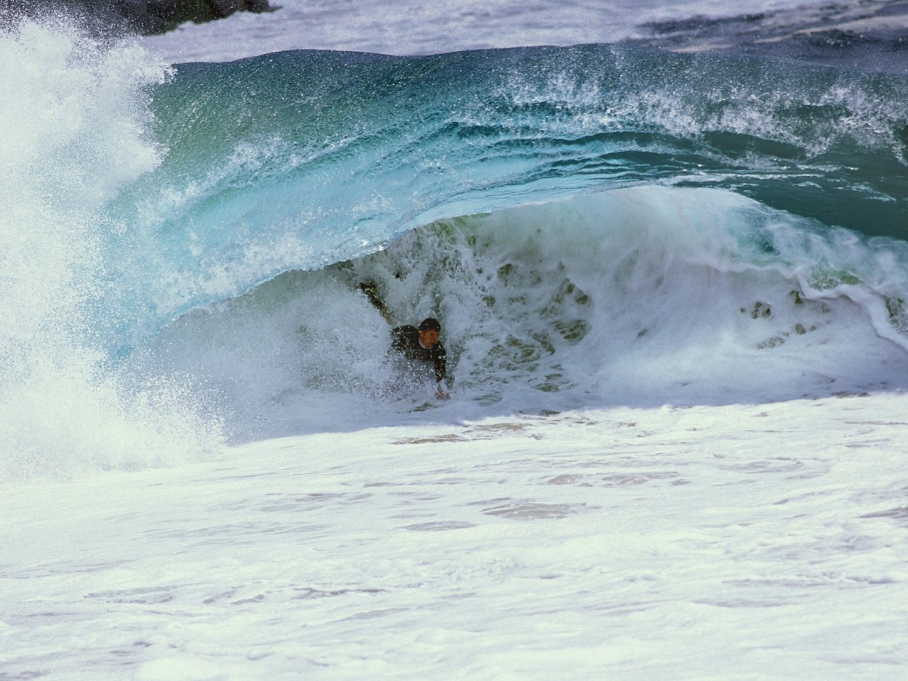 Surfer under the Wave