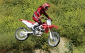Motocross - Red Honda in Flight