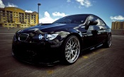 Black BMW With Sky Reflection