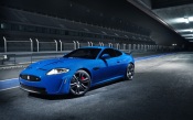 Blue Sports Car On The Racetrack