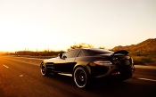 Black Mercedes-Benz SLR Driving On The Road