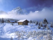 Wooden Houses at the Foot of the Mountains