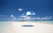 Beach Umbrella under Sunny Blue Sky. Hawaii