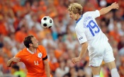 Roman Pavlyuchenko of Russia and Joris Mathijsen of Netherlands