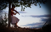 Lindsey Stirling With Violin Under the Tree