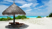 Straw Umbrella on The Beach