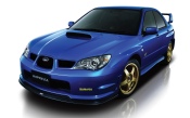 Blue Subaru Impreza With Golden Wheels