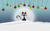 Black Cat in the Hat of Santa Claus on the Snow