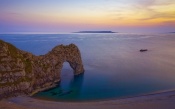 Sea, Rocks and Purple Sunset