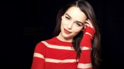 Emilia Clarke, black background